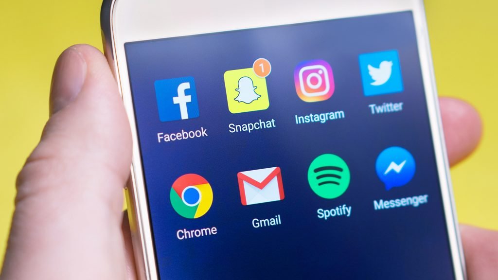 cell phone disp;aying social media management for medical spas